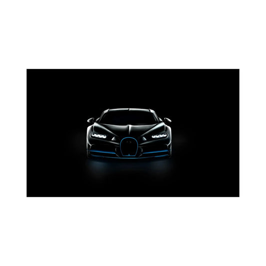 Front view of a sleek black luxury sports car with illuminated headlights on black background