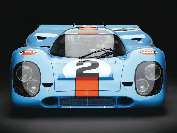 Front view of classic blue 1969 Porsche 917K race car with orange Gulf stripe and number 2