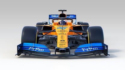 Front view of an orange and blue 2019 McLaren MCL34 Formula 1 race car with visible sponsors and aerodynamic details