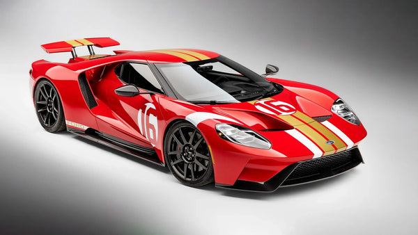 Red Ford GT Alan Mann Heritage Edition with gold racing stripes and number 16 on a gray background
