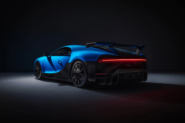Blue and black Bugatti Chiron Pur Sport 2020 sports car rear view in dark studio