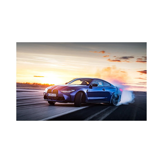 Blue sports car drifting on asphalt track at sunset with tire smoke and dynamic motion