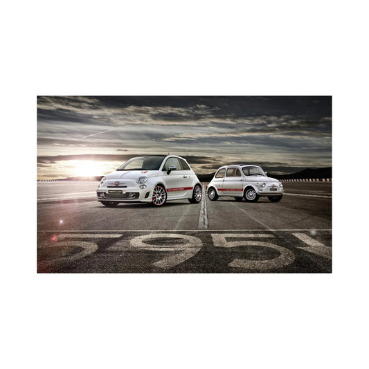 Two white Fiat Abarth 595 cars, modern and classic, parked on race track at sunset